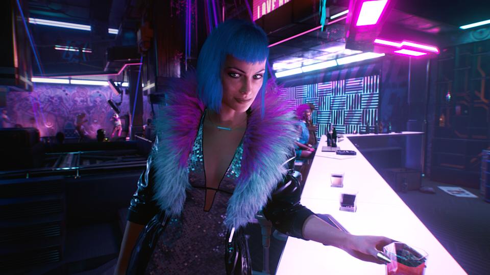 A blue-haired character in a bar in Cyberpunk 2077.
