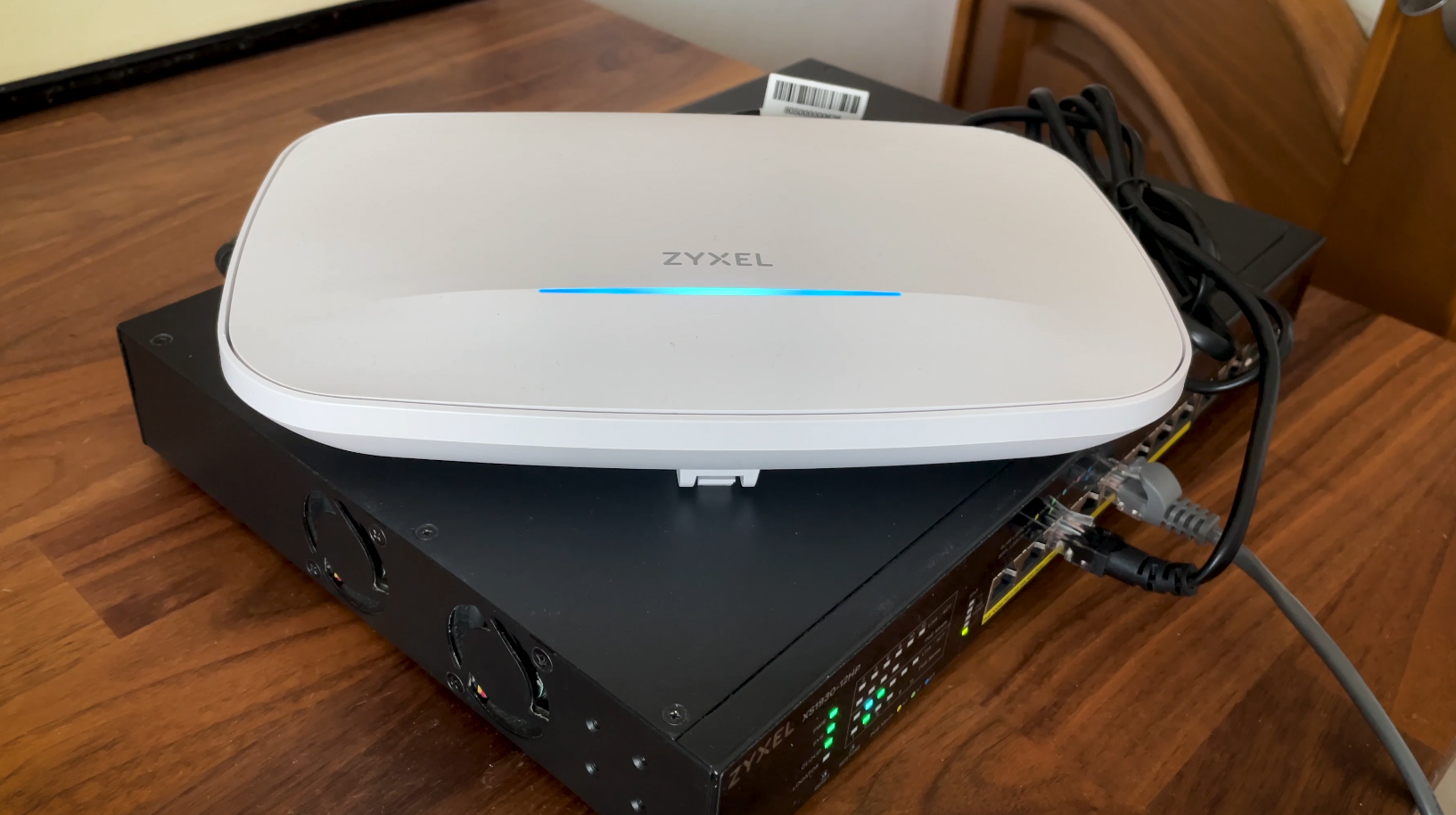 The Zyxel NWA130BE powered by a Zyxel XS1930 Ethernet switch.